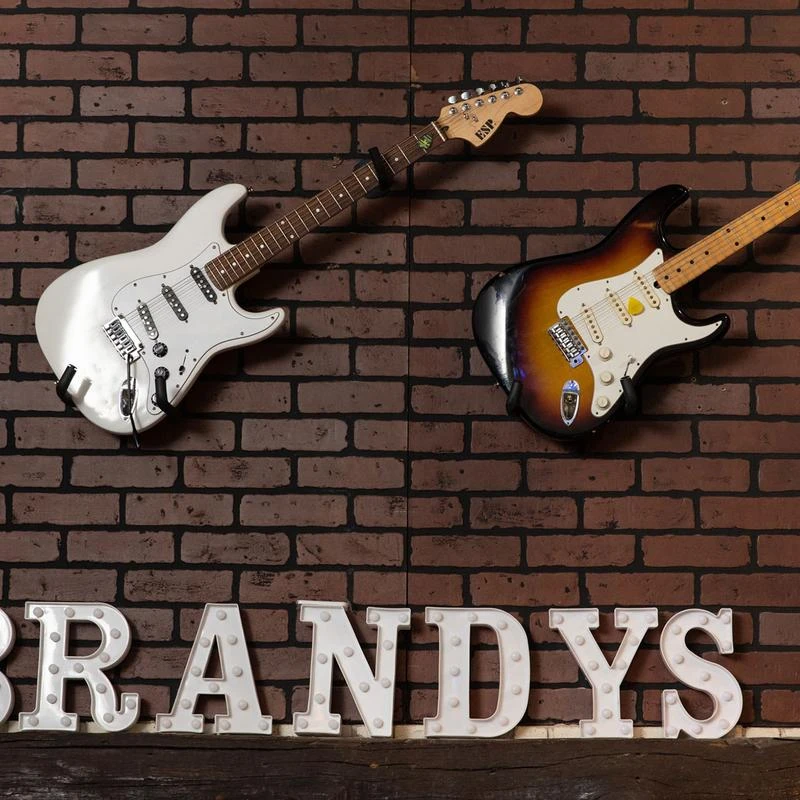 Interior, guitars hanging on the wall and the restaurant's name